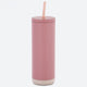 Pink tumbler with a straw on a white background