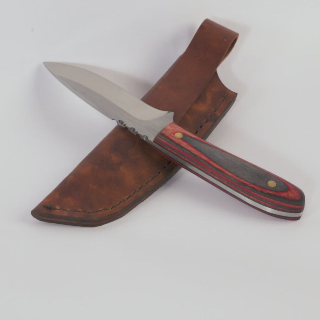 Knife with a wooden handle and leather sheath on a white background