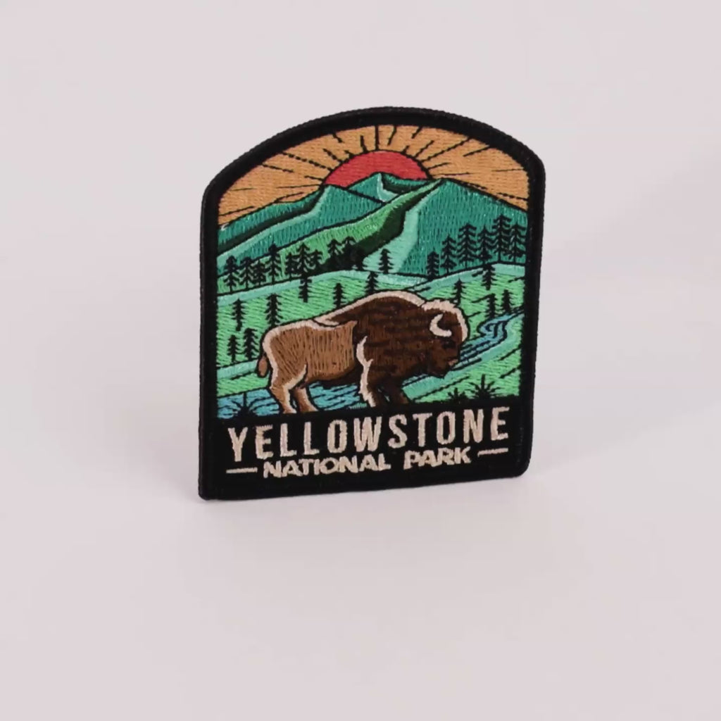 Yellowstone National Park patch with a bison and mountain landscape on a white background