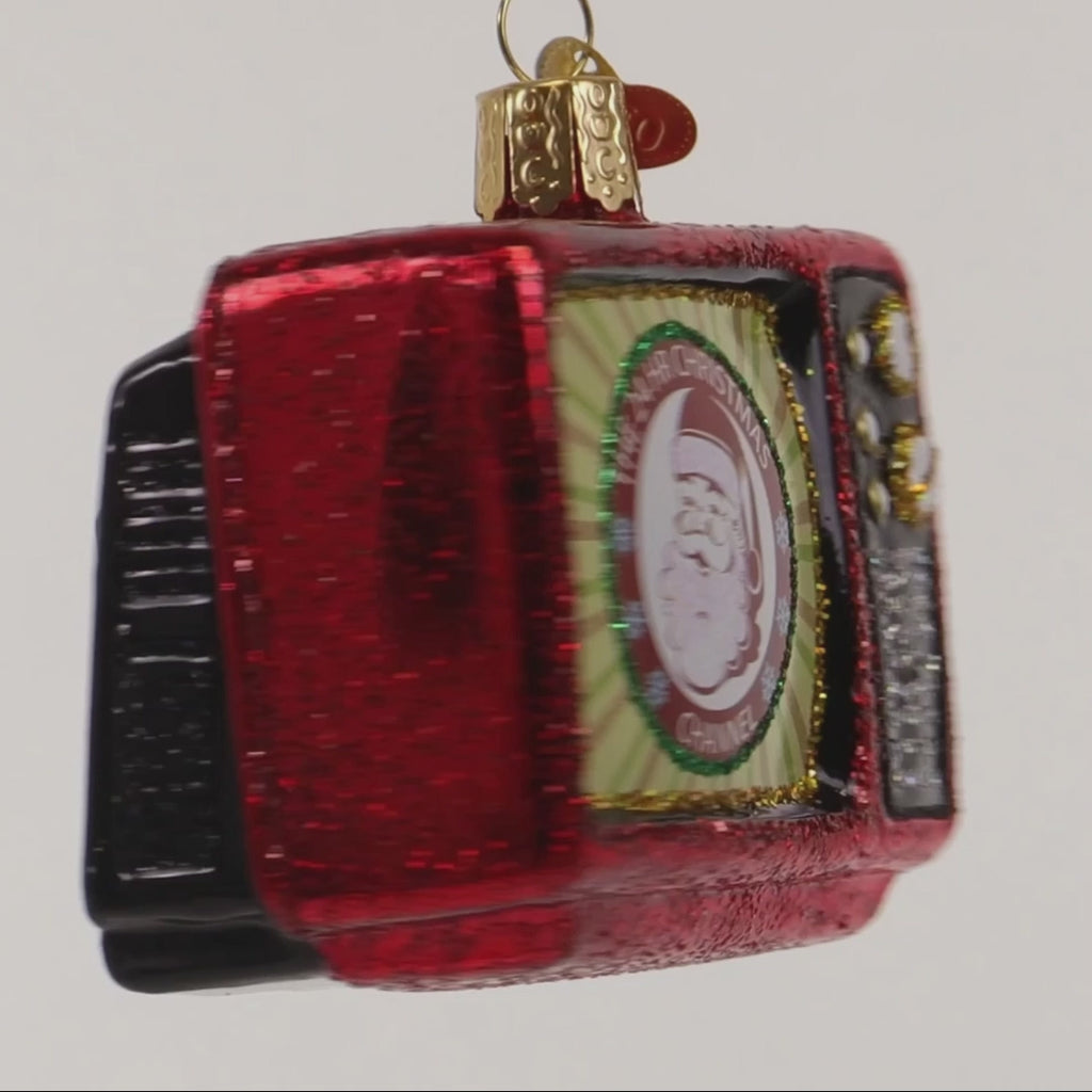 Decorative Christmas ornament resembling a television set with Santa Claus and '24 HR Christmas Channel' text.