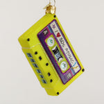 Decorative ornament shaped like a cassette tape with 'I love 80s music' text on a white background