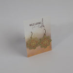 Floral earrings on a Wild Lupine Folkcraft branded card