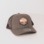 Gray trucker cap with Yellowstone National Park patch on a white background