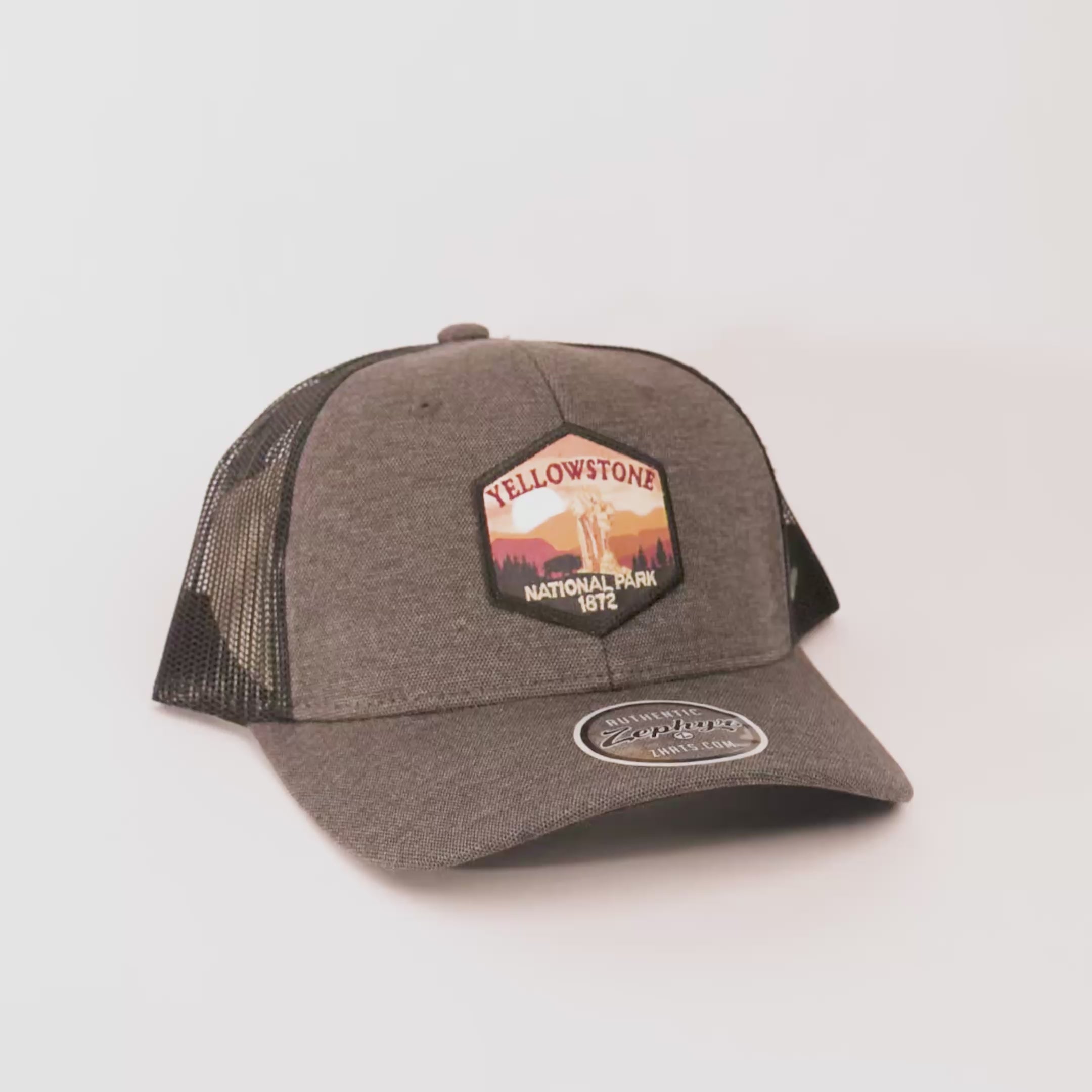 Gray trucker cap with Yellowstone National Park patch on a white background