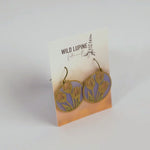 Earrings with floral design on a Wild Lupine Folkcraft card