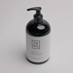 video of Ruel Hand Soap - black hand-pump jar with white labeling on a white background