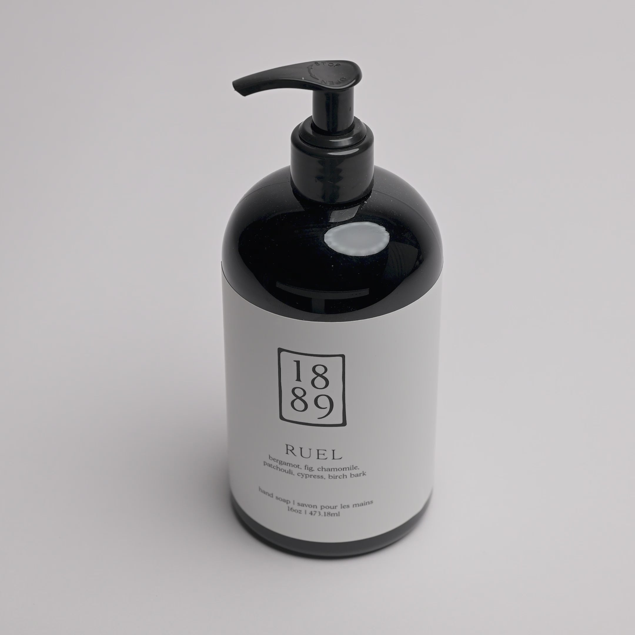 video of Ruel Hand Soap - black hand-pump jar with white labeling on a white background