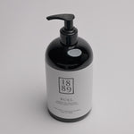 A black pump bottle of RUEL hand cream with a white label, photographed on a clean white background.