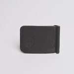 A black textured leather money clip wallet with a debossed logo on the front, shown on a clean white background.