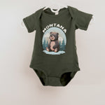 Green baby onesie with bear graphic and 'Montana' text on a white background