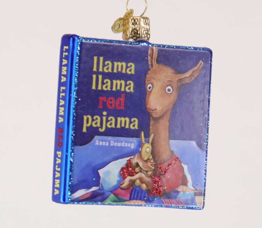 Book ornament titled 'Llama Llama Red Pajama' with a llama illustration on a blue background.