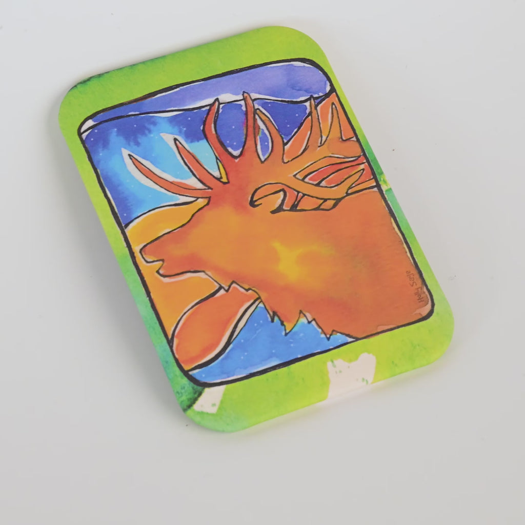 Colorful magnet with a elk design on a white background