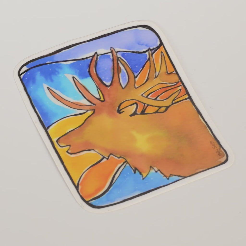 Sticker with a colorful design of a elk head on a blue and orange background