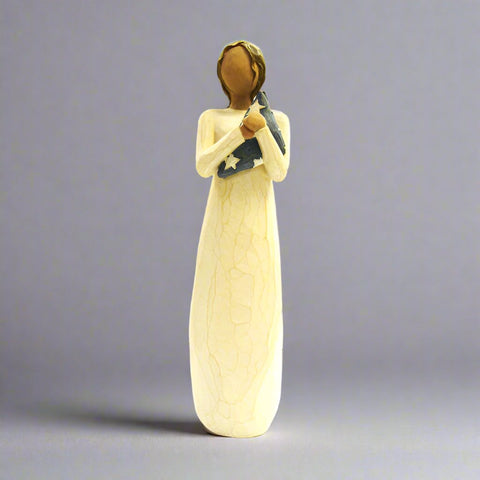 The Hero Willow Tree Figurine represents silence in honoring and remembering the lives we hold dearest to our hearts that have past in service to our country. It stands with strength and patriotism and courage, acknowledging all of those characteristics that we once saw in the hero we lost.