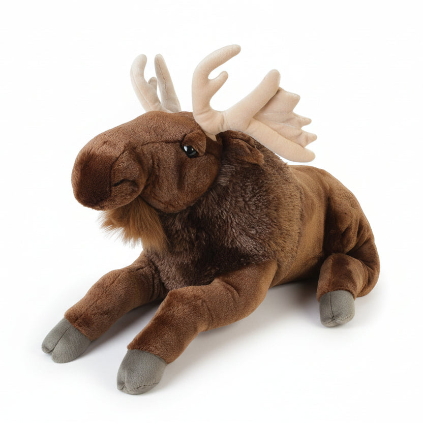 A large plush moose toy with a realistic design, lying down against a grey background.