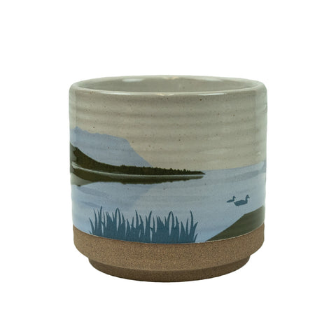 The At the Lake Candle Holder by Demdaco is a beautiful stoneware cup that withstands the heat of any candle!