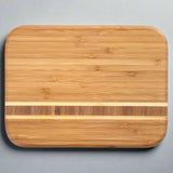 Want to make an impression when you're cutting and serving? Look no further than the Barbados Bar Cutting Board by Totally Bamboo!
