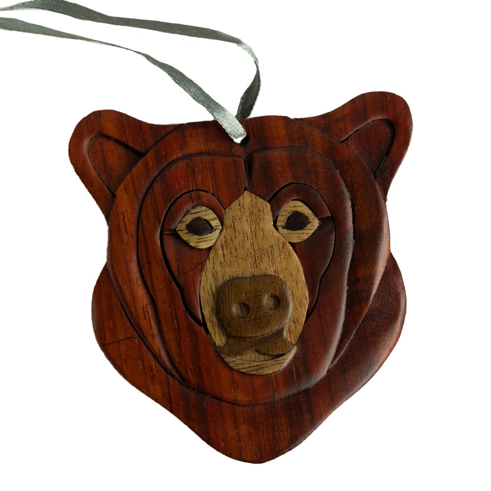  We love the Wood Bear Ornament by The Handcrafted because it uses layers of wood to craft the face.