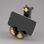The Bearfoots Butler Bear Cell Phone Caddy by Jeff Fleming features an adorable Bearfoots sculpture that is set up so he's the perfect shape to prop up your phone for easy viewing!