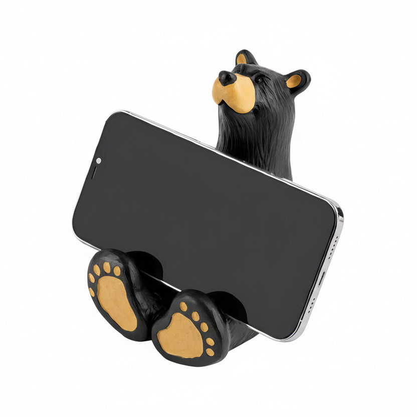 The Bearfoots Butler Bear Cell Phone Caddy by Jeff Fleming features an adorable Bearfoots sculpture that is set up so he's the perfect shape to prop up your phone for easy viewing!