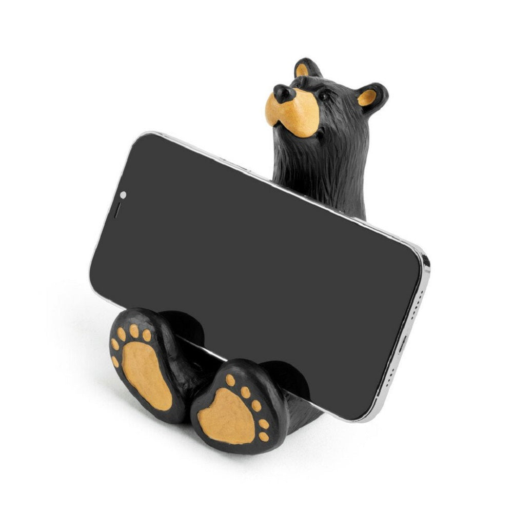 The Bearfoots Butler Bear Cell Phone Caddy by Jeff Fleming features an adorable Bearfoots sculpture that is set up so he's the perfect shape to prop up your phone for easy viewing!