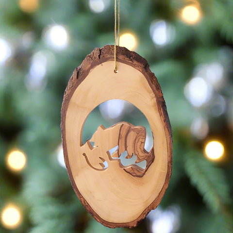 The Bear with Fish Ornament by Earthwood calls back to the origins of where the ornament was made from: nature.