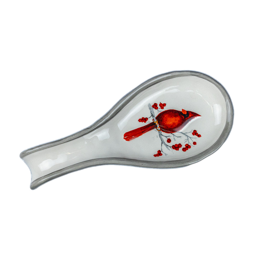 The Birch Cardinal Spoon Rest by Transpac Imports will help keep your kitchen clean and neat, while also adding a festive touch!