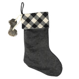 Add a classic favorite to your holiday decor with this Buffalo Check Fabric Stocking by Transpac Imports. 