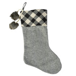 Add a classic favorite to your holiday decor with this Buffalo Check Fabric Stocking by Transpac Imports. 
