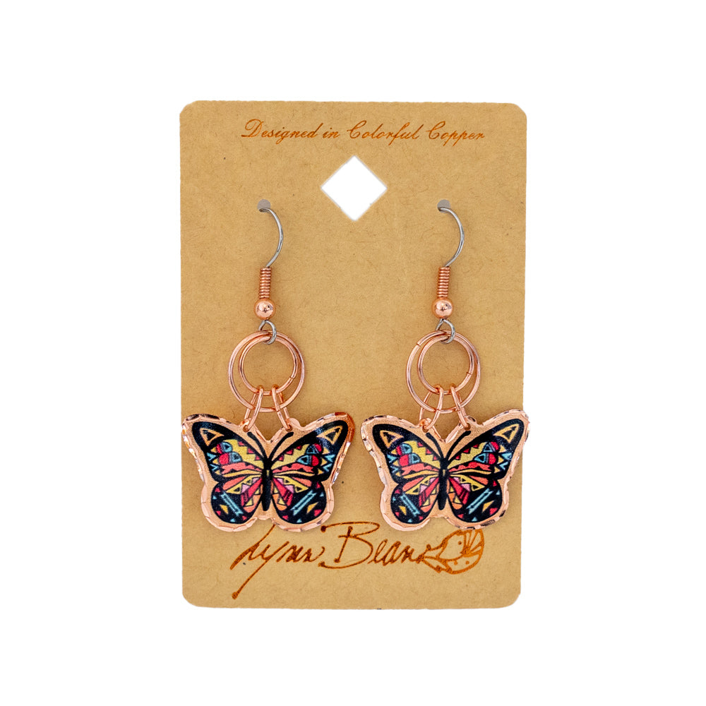 The Butterfly Jump Ring Earrings by Lynn Bean use beautiful western inspired colors and patterns paired with copper backing and rings to give you a stunning pop of color!
