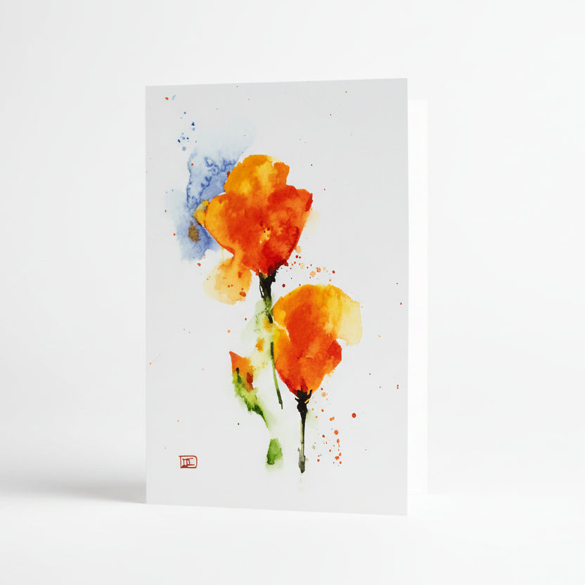A greeting card featuring a watercolor painting of orange and yellow California poppies against a green background.