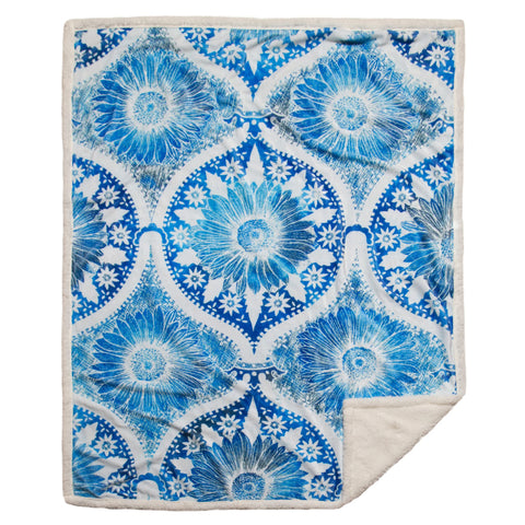The Chakra Blossom Sherpa Throw Blanket by Carstens features a stunning blue mandala pattern with a daisy in the center!