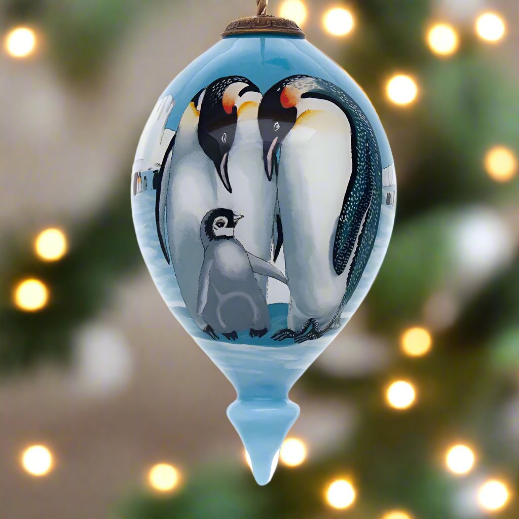 The Persis Clayton Emperor Family Christmas Ornament by Inner Beauty reminds everyone to stay warm this holiday season!