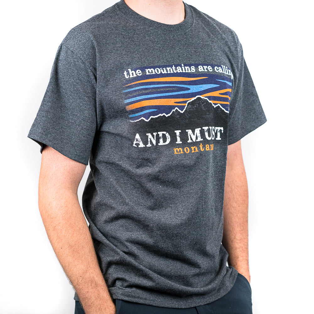 The mountains call to all of us here in Montana. The Dark Grey Mountains Calling Montana T-Shirt by Graphic Imprints is a great way to let everyone know that you have heard the mountains calling your name!