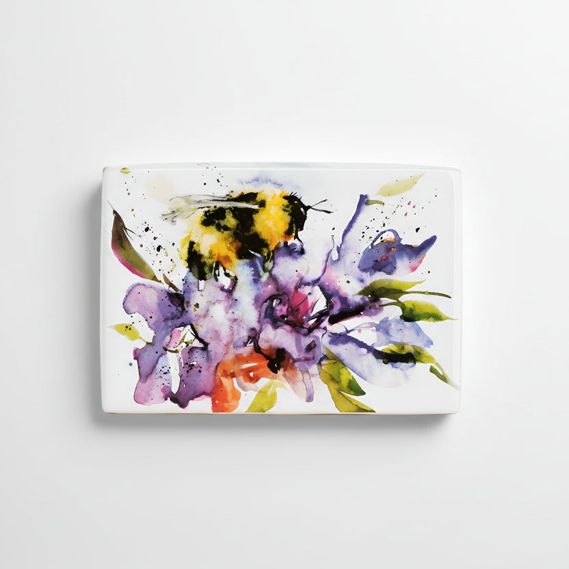 A handcrafted ceramic plaque featuring a watercolor art depiction of a bumblebee on a floral background.