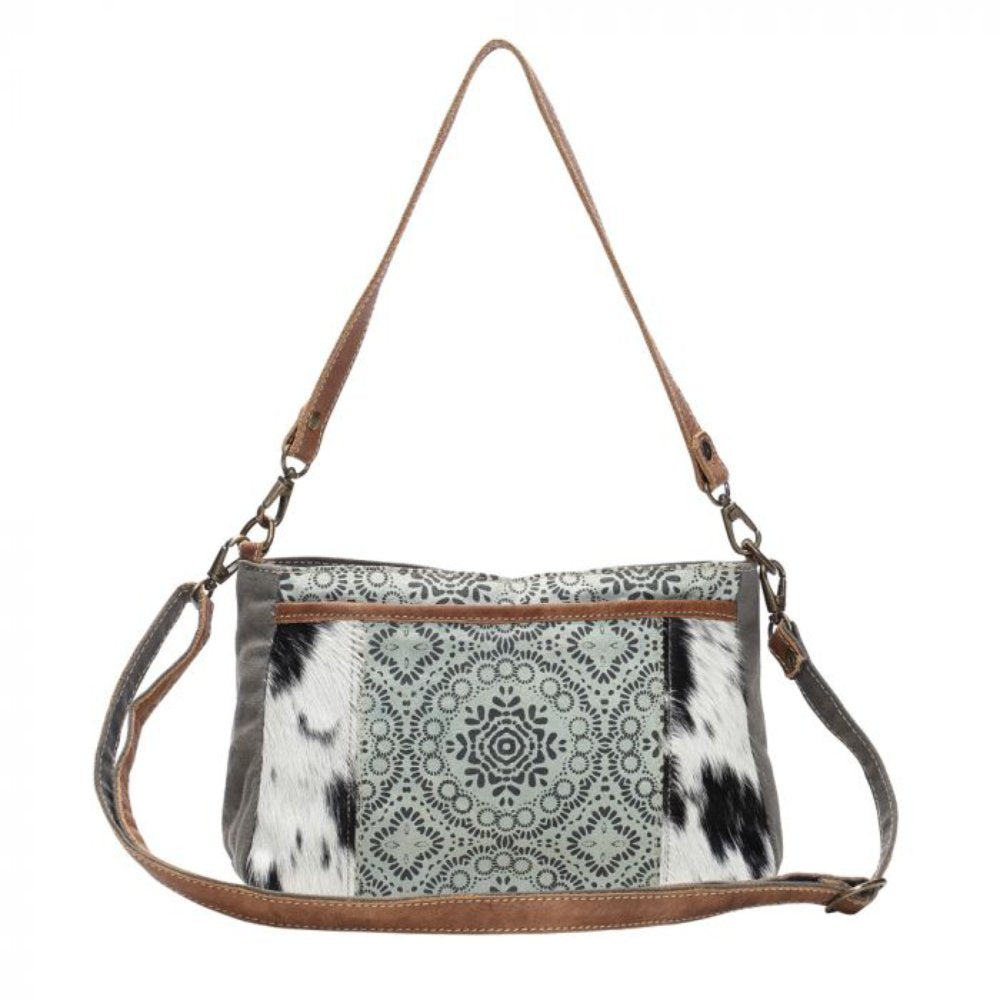 The Dual Strap Cross Body Bag by Myra Bag is a beautiful cohesive combination of canvas, leather, and hairon to bring you your perfect purse.