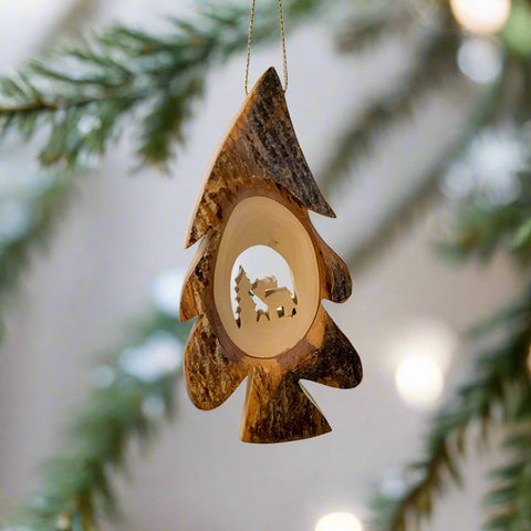 The Elk Tree Bark Ornament by Oak Wood features a beautiful scene of an elk in a wooded forest that's carved into a piece or olive tree wood. 