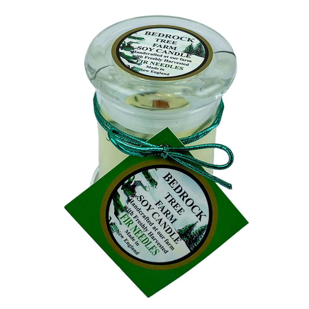 The Fir Needle Natural Soy Candle by Bedrock Tree Farm is a clean burning, wood wick soy candle that releases the fresh scent of fir into any room!
