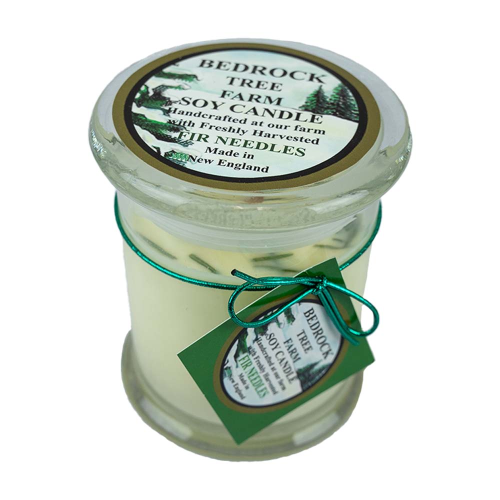 The Fir Needle Natural Soy Candle by Bedrock Tree Farm is a clean burning, wood wick soy candle that releases the fresh scent of fir into any room!