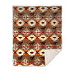 Free rein sherpa throw blanket by carstens features a light brown background with western design in light cream, with orange and red detail and brown horses