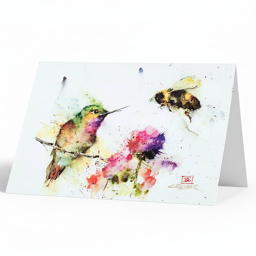 A greeting card featuring a watercolor illustration of a hummingbird and a bee with vibrant colors on a white background.