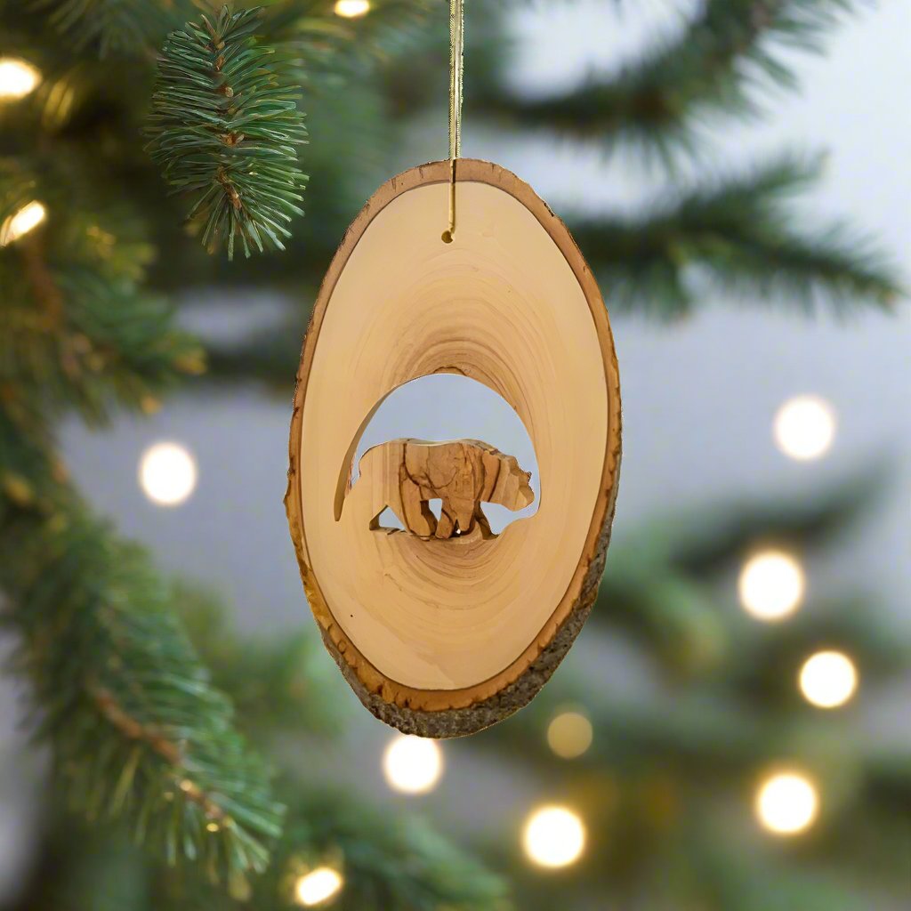 We love the quality and story behind the Grizzly Bear Ornament by EarthWood. Made from olive wood grown right in Bethlehem, this holy land ornament is crafted by a fourth generation wood carver.