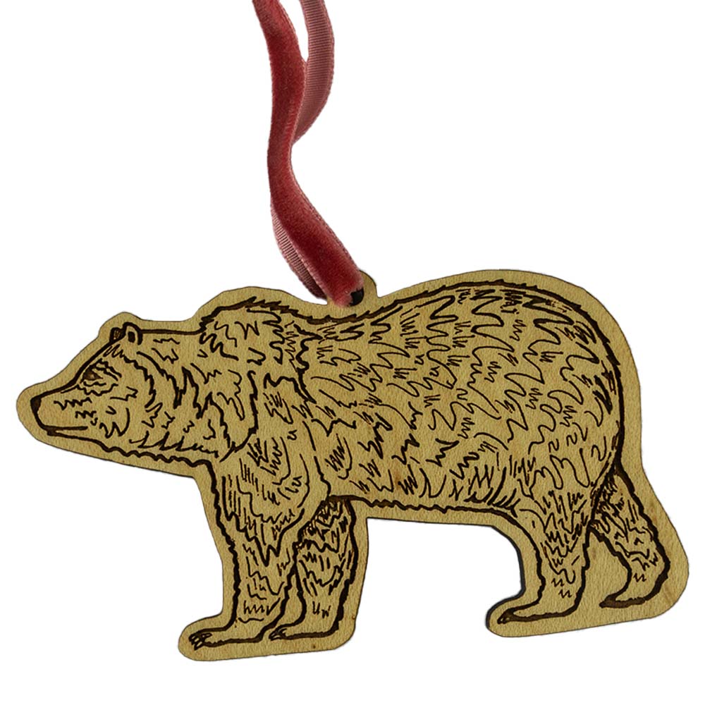 The Grizzly Ornament by Noteworthy Paper & Press is a cute illustration of a grizzly bear, Montana's state animal engraved on wood to give you a natural, sturdy option.