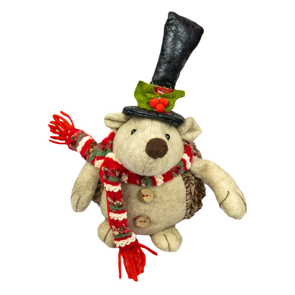 Hedgey the Hedgehog by Oak Street Wholesale is a Christmas themed hedgehog who dons his favorite holiday scarf and hat before journeying out in the cold.
