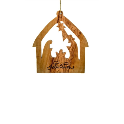 The Medium Nativity House Ornament by Earthwood features a barn shape design with a hand-carved nativity scene inside, all part of an olive wood ornament.