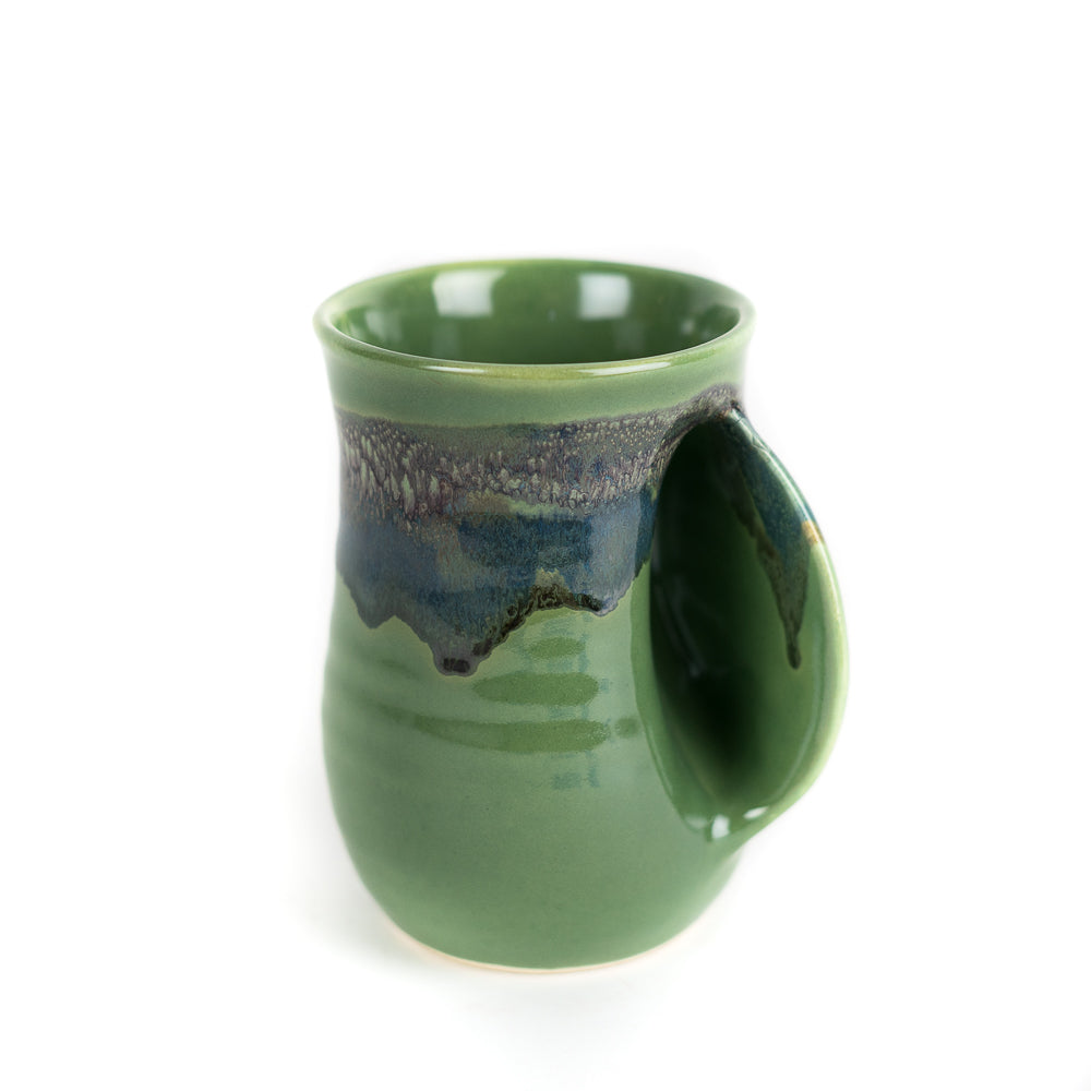 https://www.giftcorral.com/cdn/shop/products/Misty_Green_Right_handed_mug_by_Clay_in_Motion_75817.jpg?v=1608142866