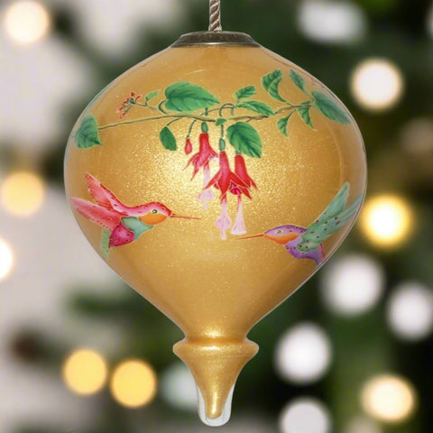 The Parvaneh Hummingbirds and Flowers Ornament by Inner Beauty is a wonderful warm contrast to what may be going on outside your window. 