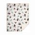 pinecone sherpa throw blanket by carstens features a white background with light green pine leaves and pinecones all over in a repetitive pattern