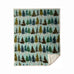 snowflake forest sherpa throw by carstens features a light blue, snowy background with pine trees in a repetitive design