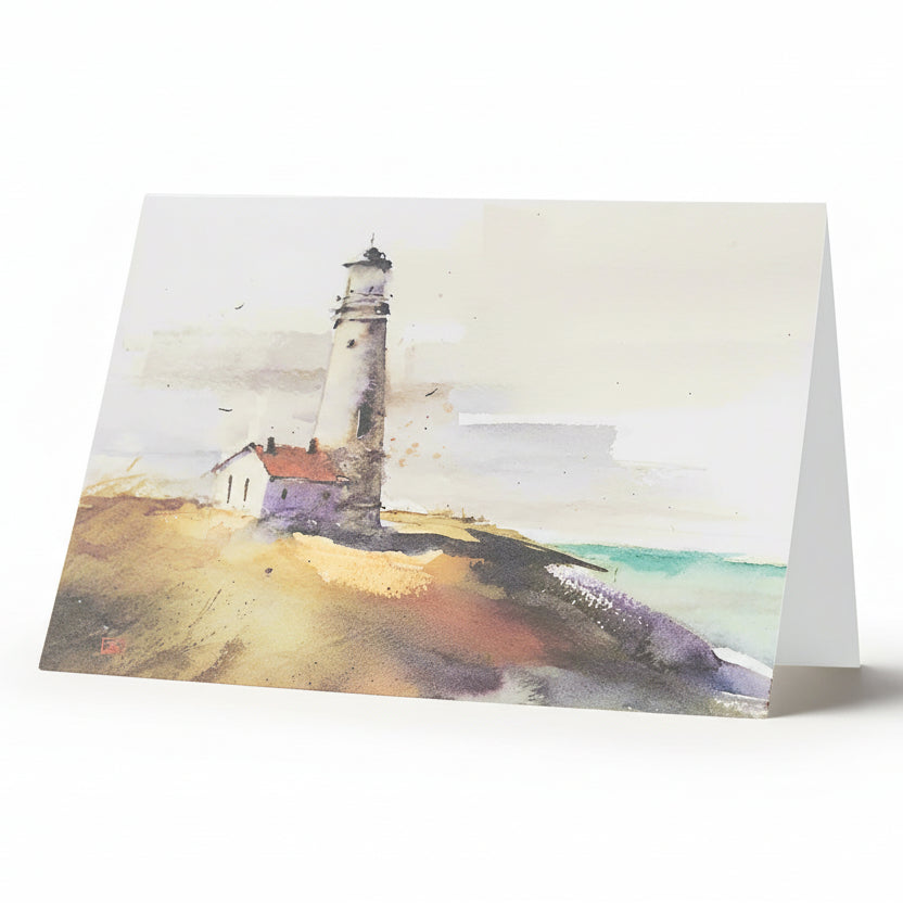 A greeting card featuring a watercolor painting of a lighthouse on a cliff overlooking the sea.